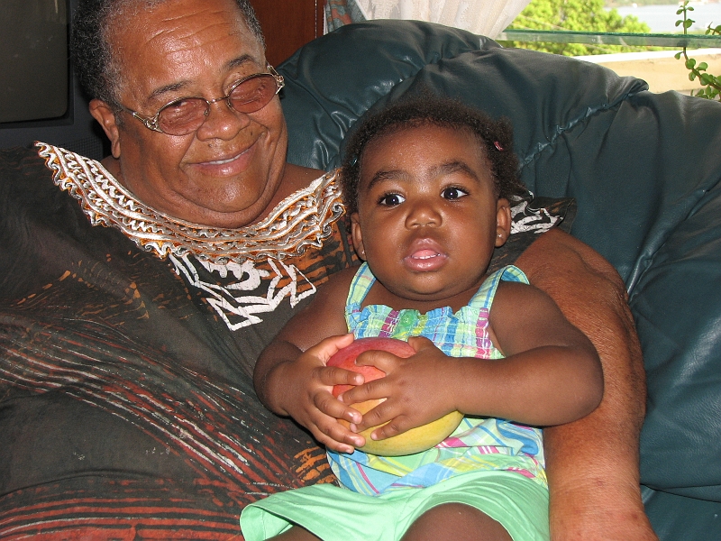 Antigua_Vacation_267.JPG - Ann (young friend of my mom's) and Mikayla. What M. holds in her tiny hands are giant, sweeeeeeeeeeeeeeet mangoes from Ann's trees
