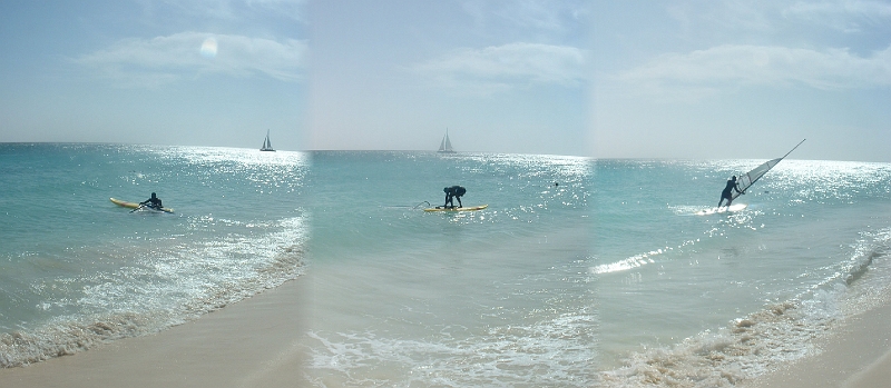 Aruba_044-046.jpg - Back at the beach:  A guy was learning to windsurf, and I asked to give it a shot.  It's a lot harder than it looks.  I think I was vertical for all of 6 secs! Gotta try it again some day...