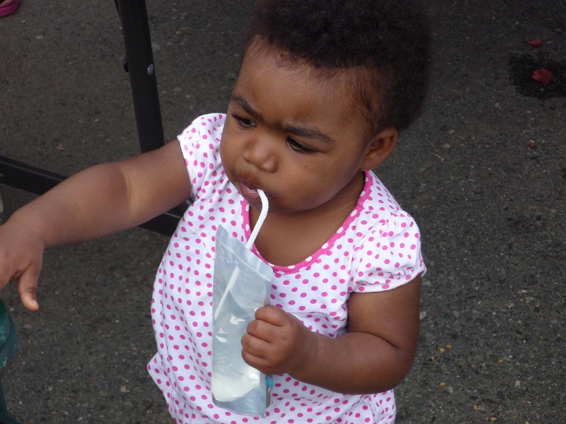 Family_Fun_Day_038.JPG - Drinking out of a bag with a plastic straw for the very first time.  If you're a parent, you understand the "drink squirts out of straw and soaks kid" disaster that was averted  :-))))