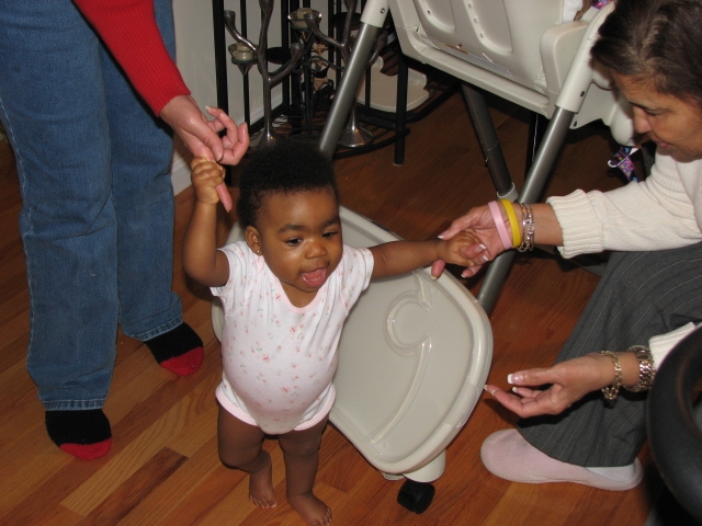 1st_bday_valentine_032.JPG - Mikayla started walking exactly one week prior to her birthday.  She's showing off here for Nanna after getting a little head start :-)