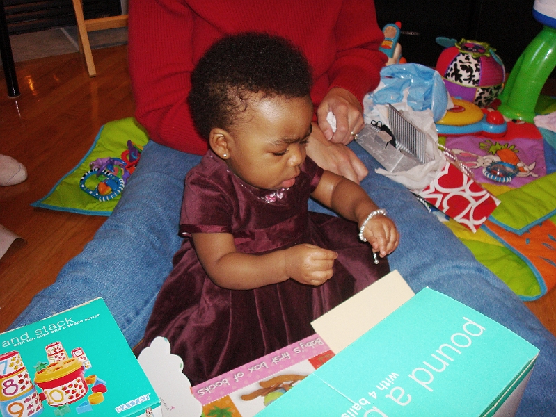 Bday-Valentine_0041.jpg - Look at that concentration...This special keepsake from Mommy and Daddy doesn't look like a toy....hmmm