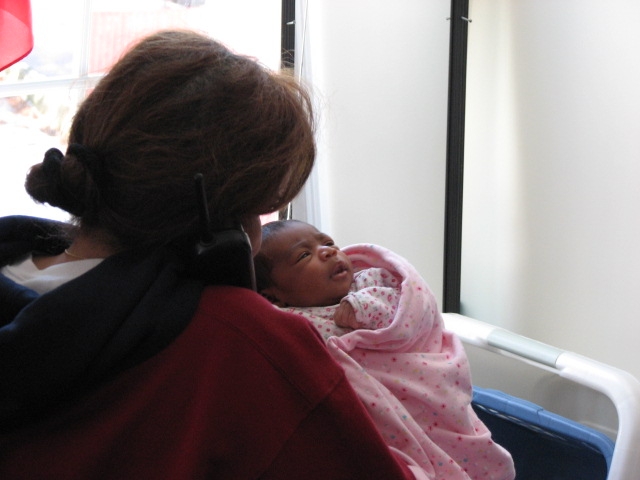 More_Mikayla_191.JPG - Nanna Sandy telling everyone how her 7th granddaughter is the cutest and nicest one of them all...at least, I think that's what she's saying... :-)