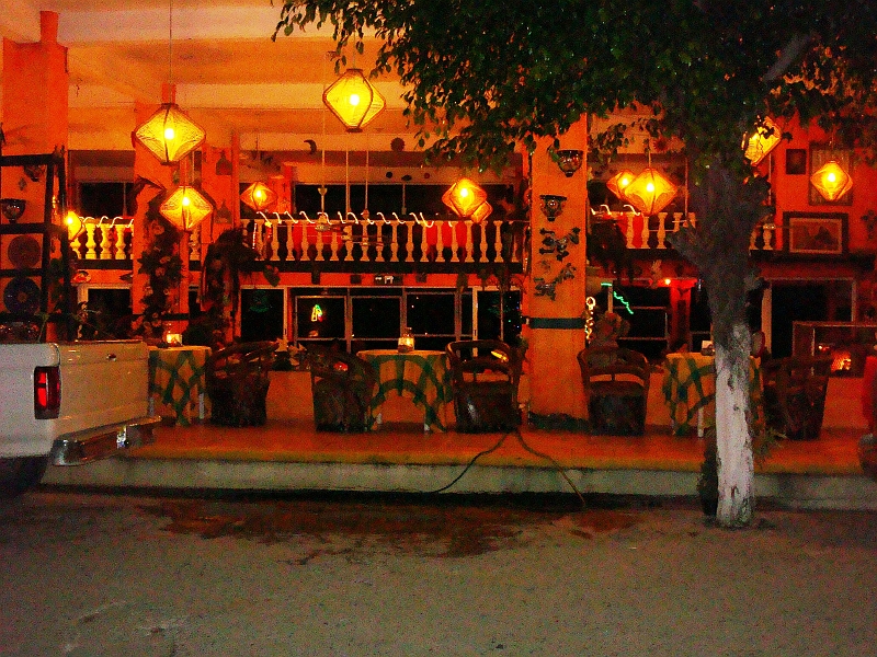 Puerto_Vallarta_153_ed.jpg - This is an outside shot of one of our favorite restaurants Adrianos in Bucerias, a small town north of Nuevo Vallartas.  Fred and I had the barbequed Whole Red Snapper.  I could go back right now and eat another.  I wish I knew the recipe.  It's one of the best fish dishes I ever had.  Now, if we can only get the owner, her entire family and the wait staff to stop playing with Mikayla and making coo faces.